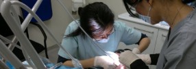 Dentist, dental assistant and patient